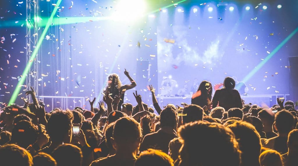 Young people dancing at night club